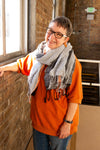 Fair Anita graphite striped scarf worn as an accessory, showcasing its generous 70-inch length and drape