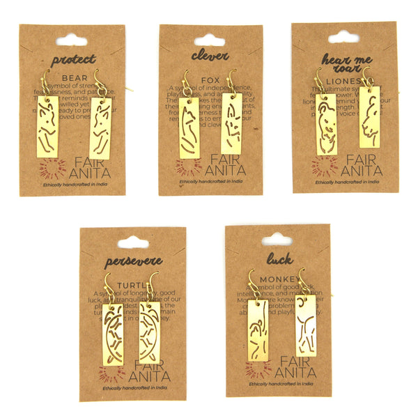 Gold-plated recycled brass animal cut out earrings by Fair Anita on a flat lay surface