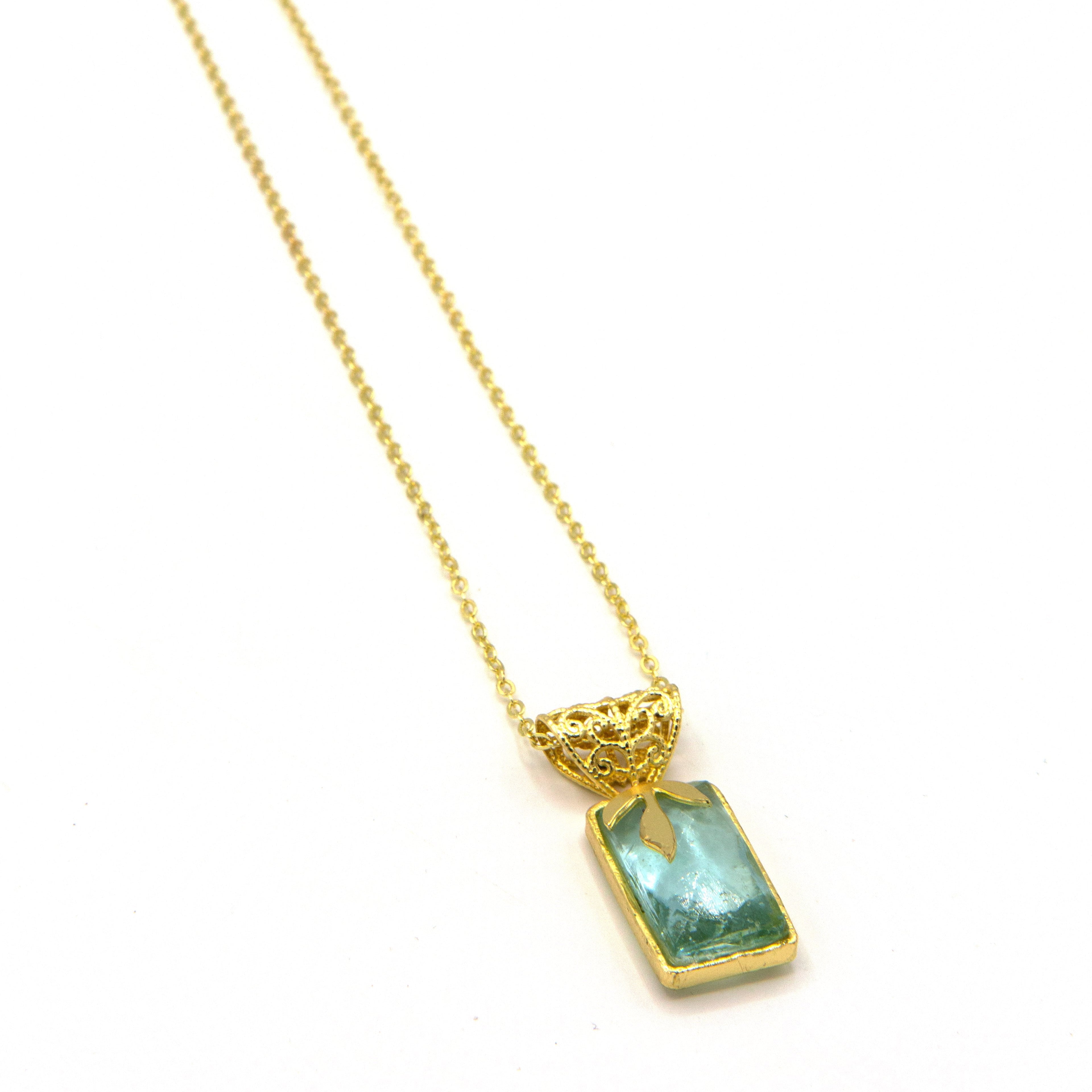 Promenade Glass Pendant Necklace in gold-plated recycled brass by Fair Anita, worn as a standalone piece