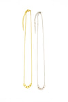 Fair Anita Glow Lite Necklace flat lay showing gold-plated recycled brass finish and adjustable chain