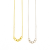 Fair Anita Glow Lite Necklace in gold-plated recycled brass, worn as a standalone pendant