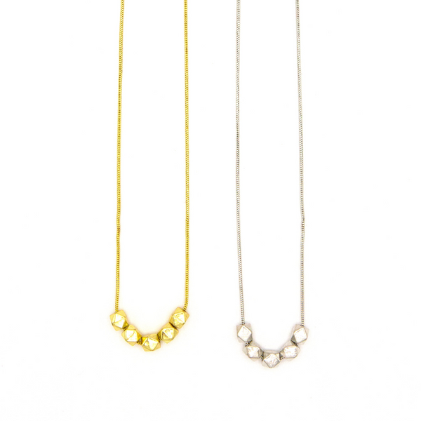 Fair Anita Glow Lite Necklace in gold-plated recycled brass, worn as a standalone pendant