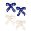 Fair Anita beaded bow earrings handmade with glass beads and sequins on a light background