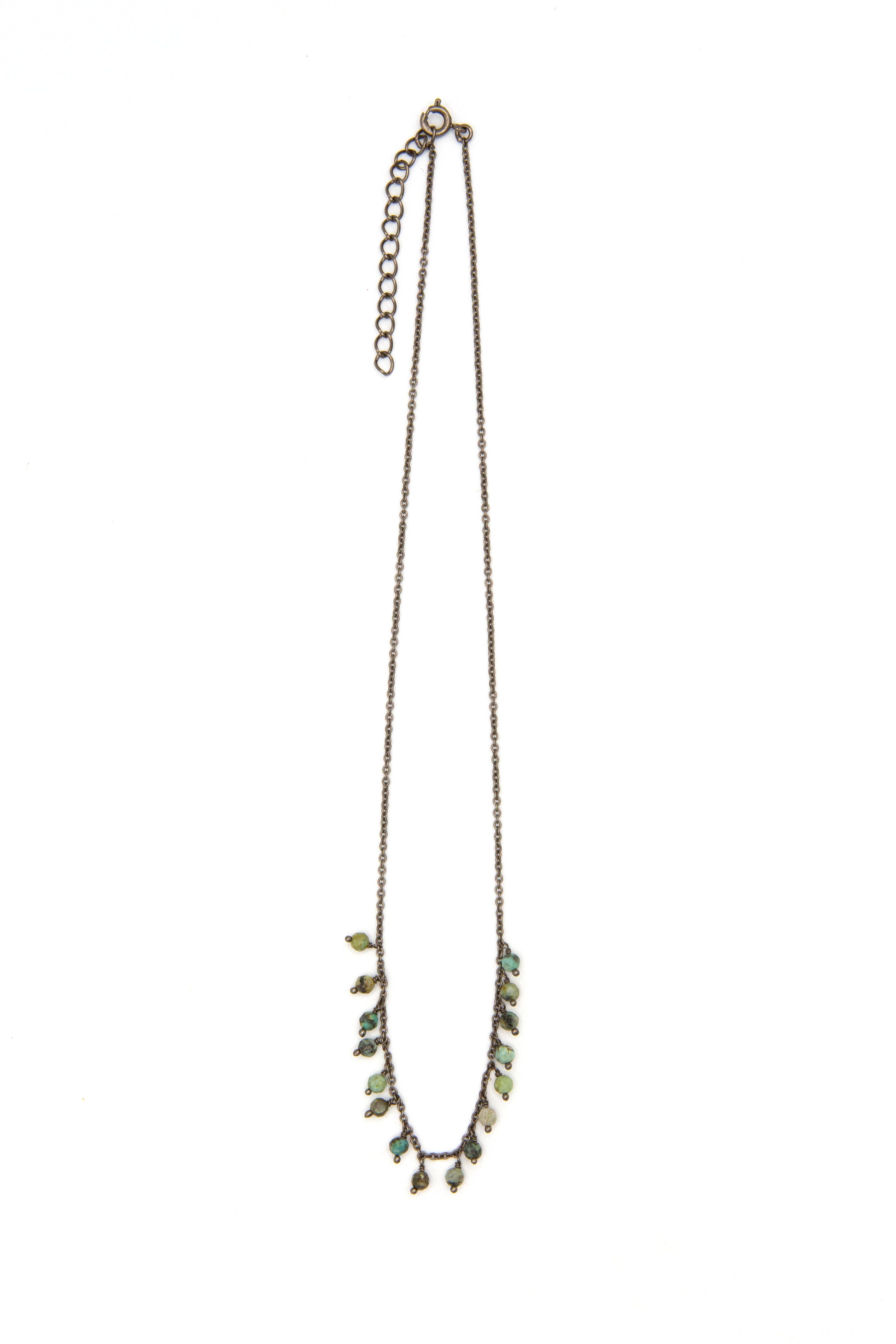 Close-up of Turquoise Drop Luxe Necklace showing natural turquoise stone drop and nickel-free rhodium chain detail