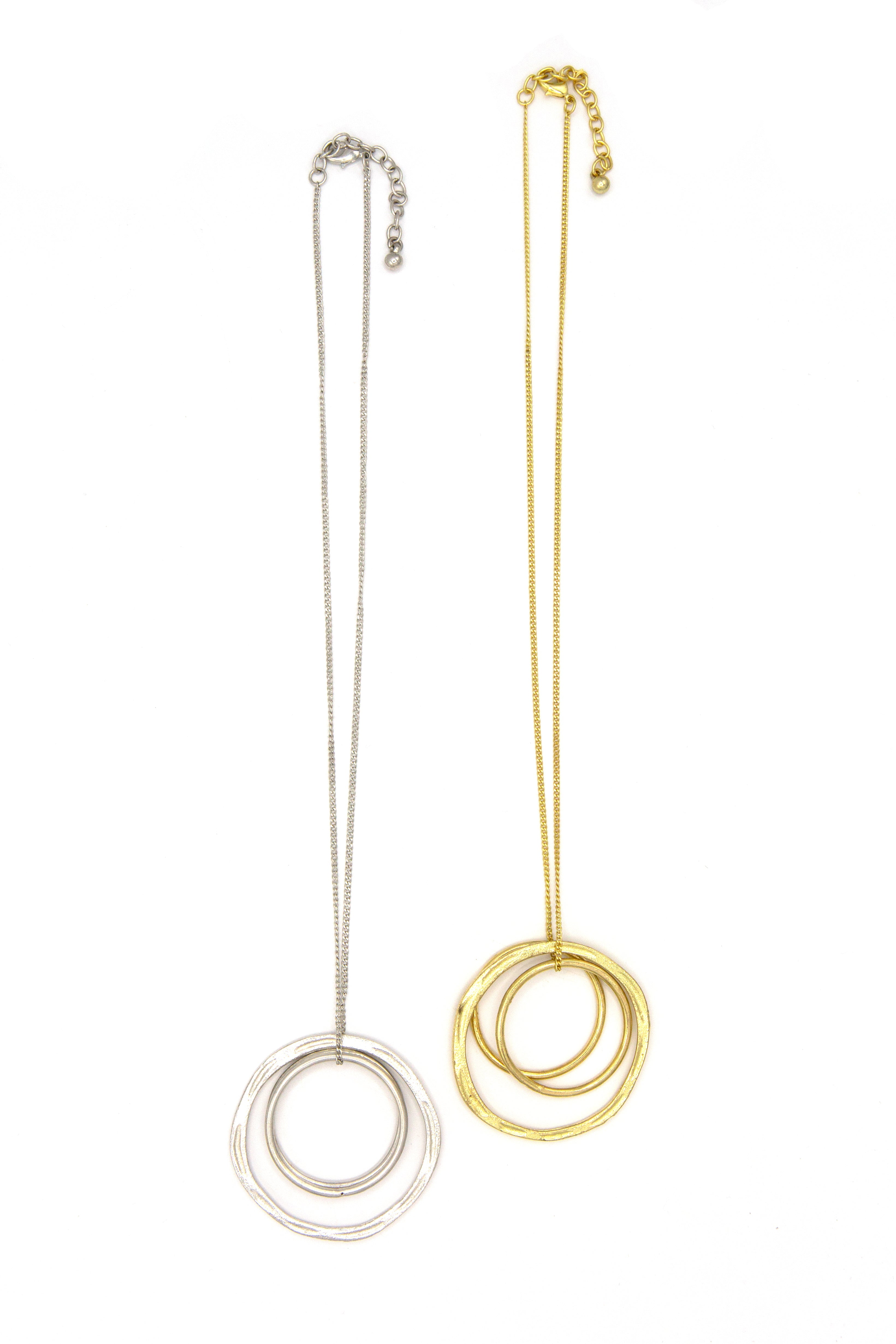 Fair Anita Linked Rings Pendant Necklace in gold tone worn as a layered necklace on model