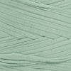 Close-up of Agave recycled fabric yarn showing flat ribbon texture and earthy green tone