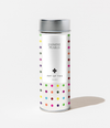Tea canister with colorful polka dot pattern on a white background