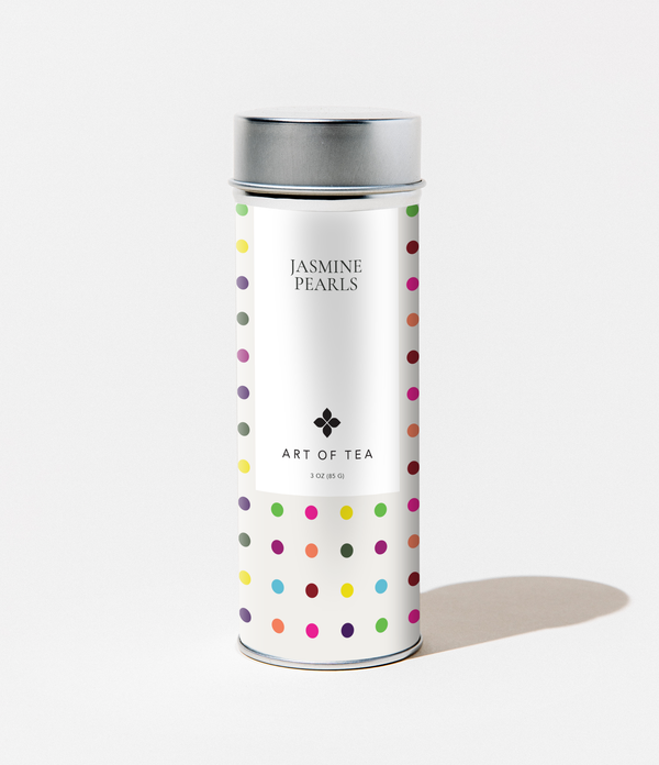 Tea canister with colorful polka dot pattern on a white background
