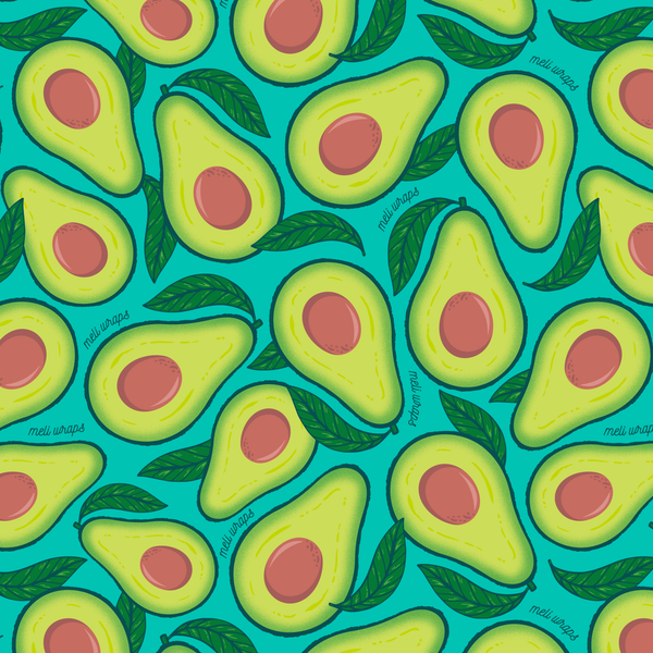 Pattern of sliced avocados with pink centers on a teal background