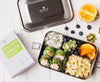 Side view of ecozoi leak-proof stainless steel lunch box with lid fastened, showing compact dimensions