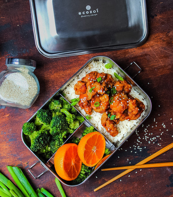ecozoi stainless steel lunch box open showing three food compartments and included mini sauce container