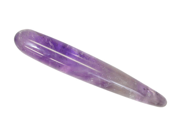 Close-up of polished amethyst yoni wand showing natural crystal colour and texture
