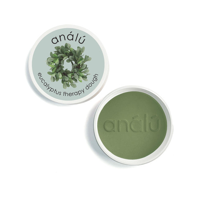 Análõ eucalyptus therapy dough container with green dough on a white background
