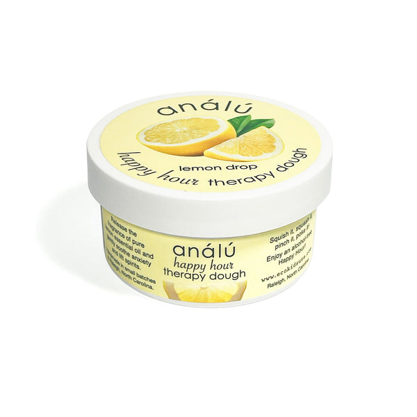 Jar of analóu lemon drop therapy dough on a white background