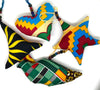 Collection of handmade African wax print patchwork ornaments in vibrant Ankara fabric patterns