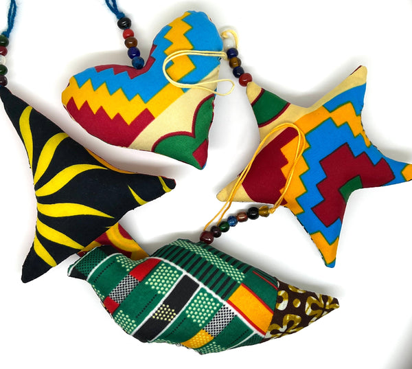 Collection of handmade African wax print patchwork ornaments in vibrant Ankara fabric patterns