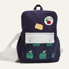 Navy blue backpack with green apple patterns and visible branding on a white background