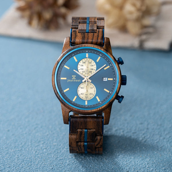Close-up of Aries zebrawood watch dial showing 60-minute, 60-second, and 24-hour chronograph subdials