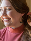 Close-up of Fair Anita Art Deco Half Moon Earrings showing upcycled horn detail and brass loop