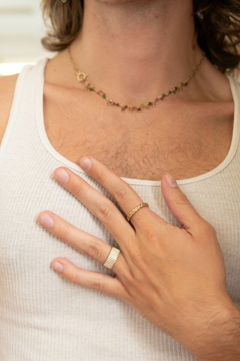 Stately Striped Brass Ring styled with other fair trade brass jewellery pieces on a warm autumnal flatlay