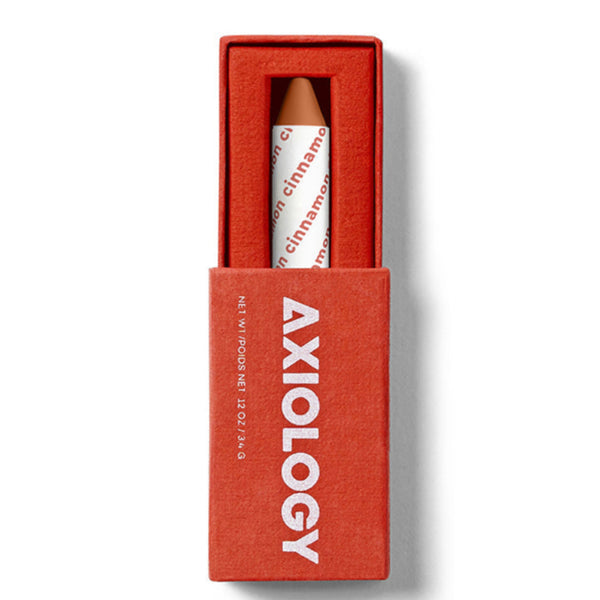 Red Axiology box with a white and red product inside on a light gray background