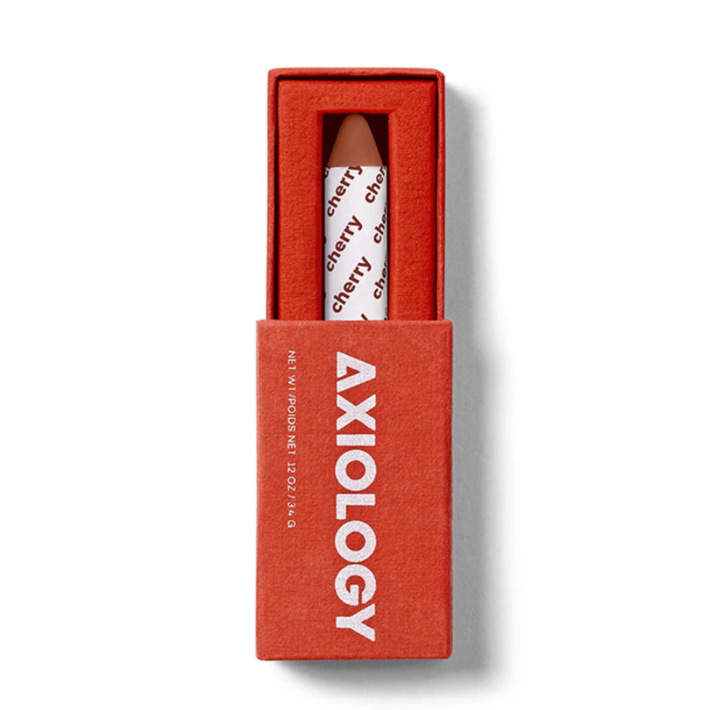 Red Axiology box with a white and red product inside on a light gray background