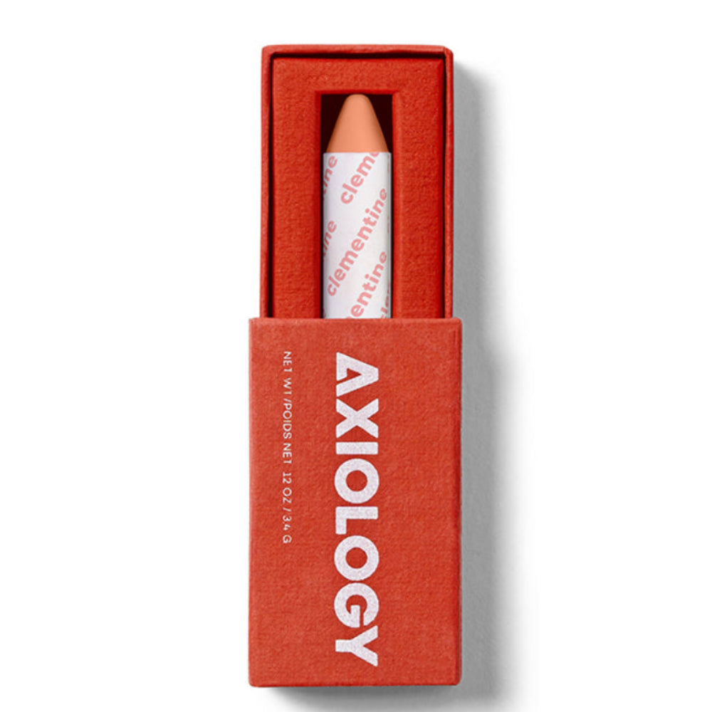 Axiology makeup pencil in a red box on a white background. Axiology's award-winning Balmie crayon — vegan, plastic-free & handmade in the USA. Multi-use color for lips, eyes & cheeks. On Oprah's Favorite Things List. Shop now.