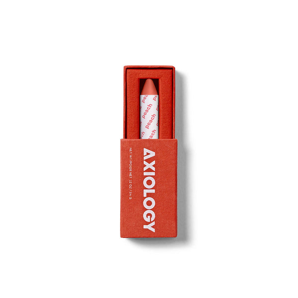 Lipstick in a red box with 'Axiology' branding on a white background