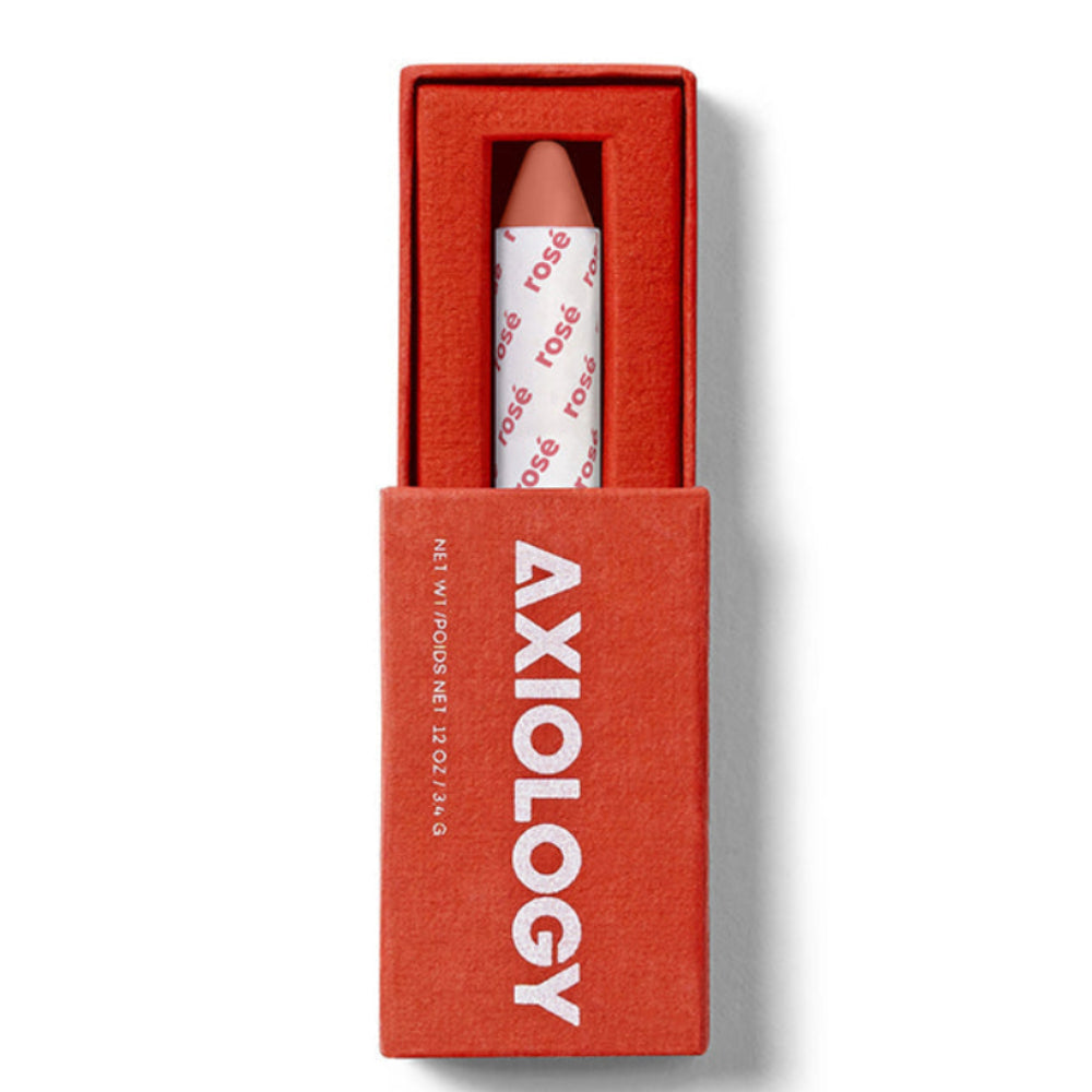 Lipstick in a red box with 'Axiology' branding on a white background