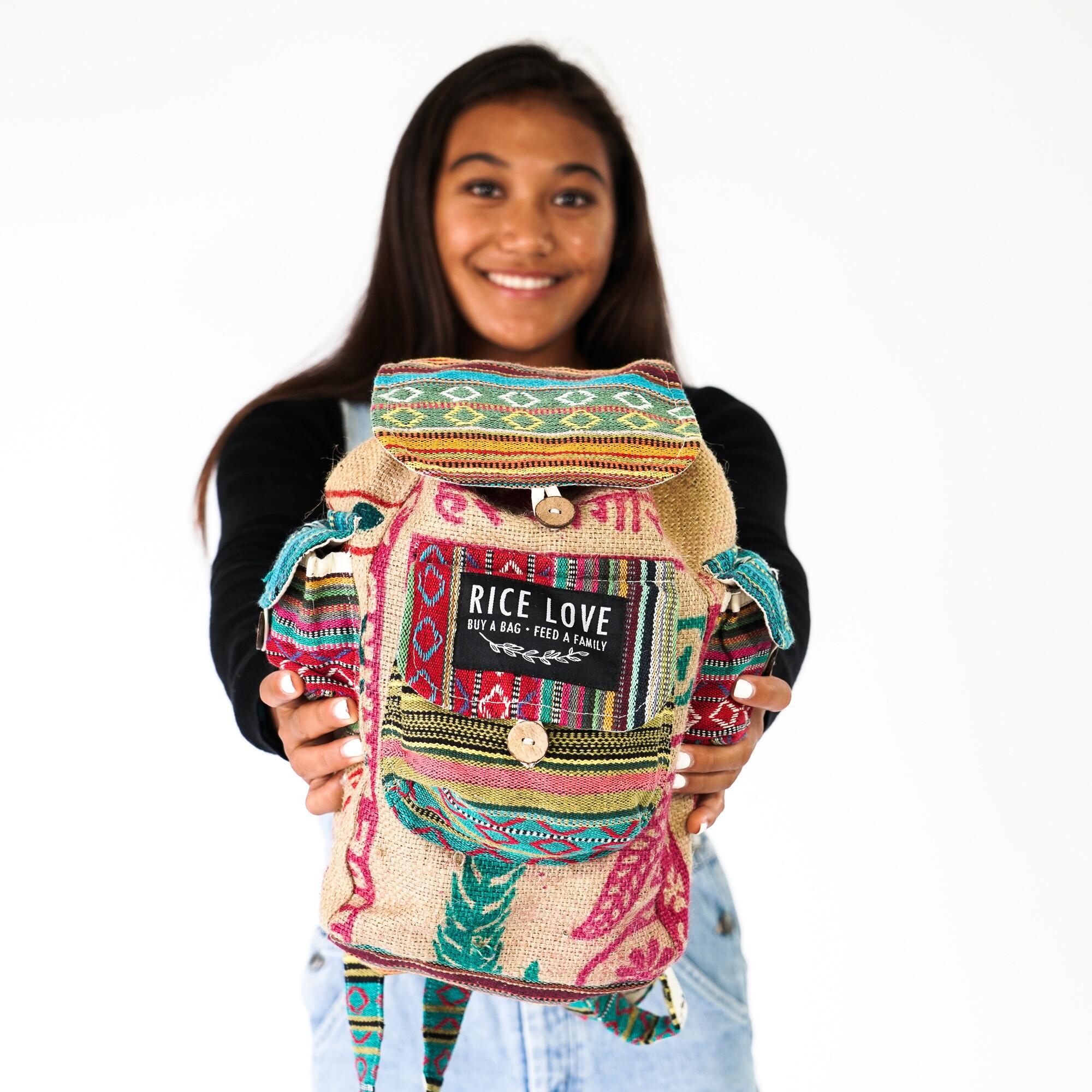 Side view of the Mini Recycled Travel Backpack Agra showing straps and design