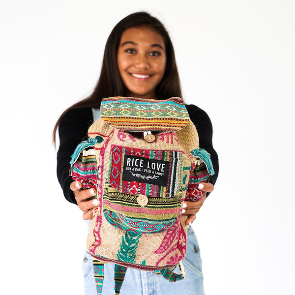 Side view of the Mini Recycled Travel Backpack Agra showing straps and design