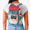 Person wearing a colorful backpack with 'Rice Love' label on a white background