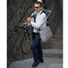 Groovy Messenger Bag in grey lifestyle shot showing crossbody carry and carabiner detail