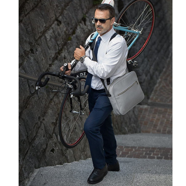 Groovy Messenger Bag in grey lifestyle shot showing crossbody carry and carabiner detail