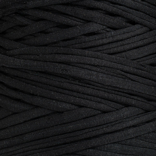 Close-up of Ganxxet Black Recycled T-Shirt Fabric Yarn showing 25mm flat fabric strip texture and weave detail
