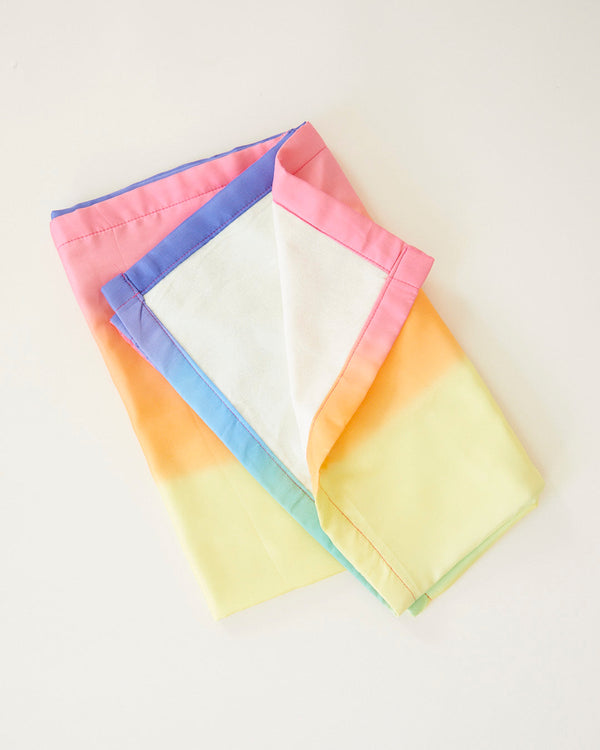 Baby wrapped in Sarah's Silks naturally dyed rainbow silk blanket