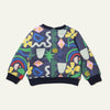 Close-up of Mon Coeur baby sweatshirt showing snap button back closure and ribbed hem detail
