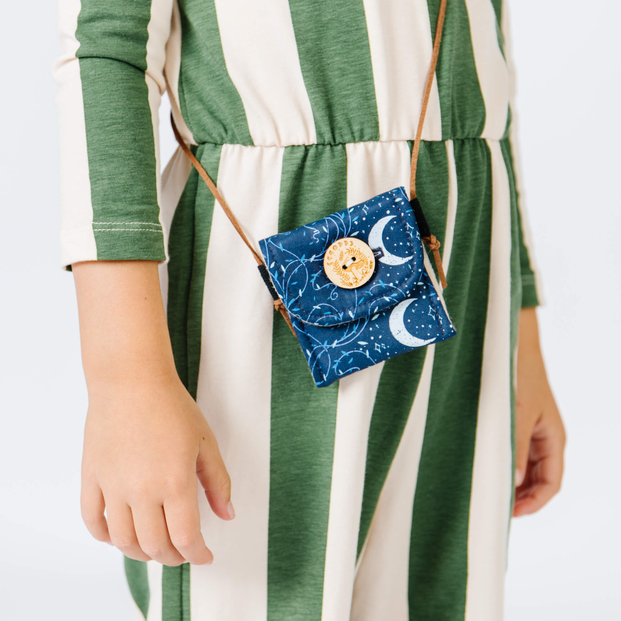 Small fabric bag for crystals and keepsakes with decorative wooden moon and mushroom button