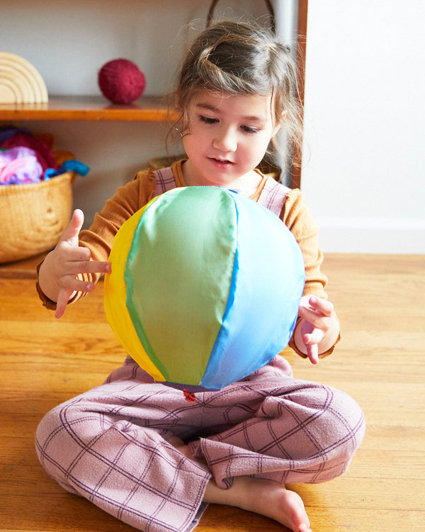 Sarah's Silks Rainbow Balloon Ball hang tag showing safety warnings