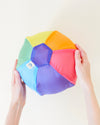 Sarah's Silks Rainbow Balloon Ball shown with its lightweight silk storage bag