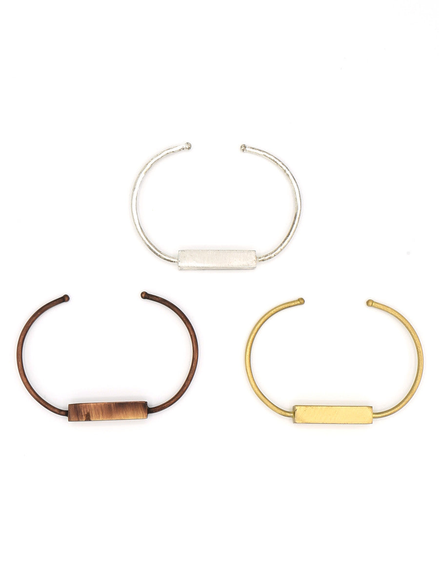 Fair Anita Bar Brushed Metal Cuffs displayed together, recycled metal adjustable bracelets in multiple finishes