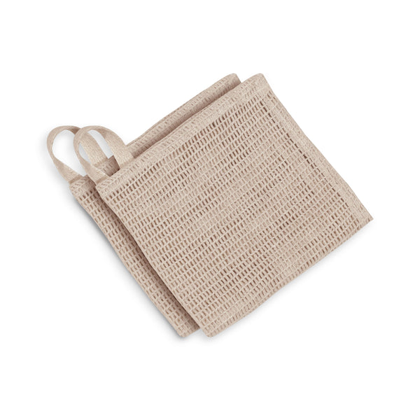 Two beige sponges with handles on a white background