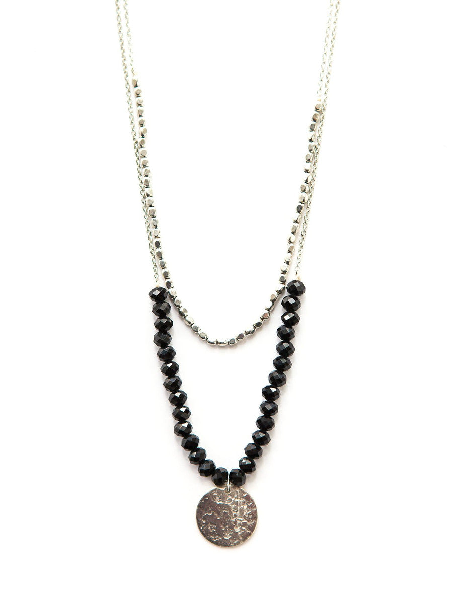 Black beaded convertible necklace in silver-plated recycled metal by Fair Anita, styled as a layered two-strand look