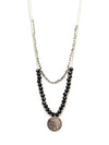 Black beaded convertible necklace in silver-plated recycled metal by Fair Anita, styled as a layered two-strand look