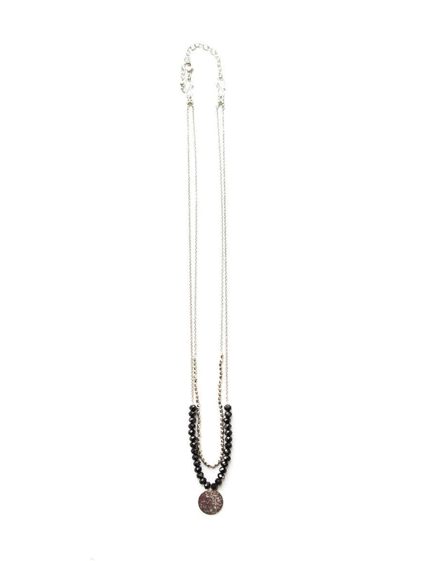 Long beaded necklace with a pendant on a white background