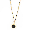 Black beaded gold drop necklace by Fair Anita, handcrafted fair trade jewelry with recycled brass chain