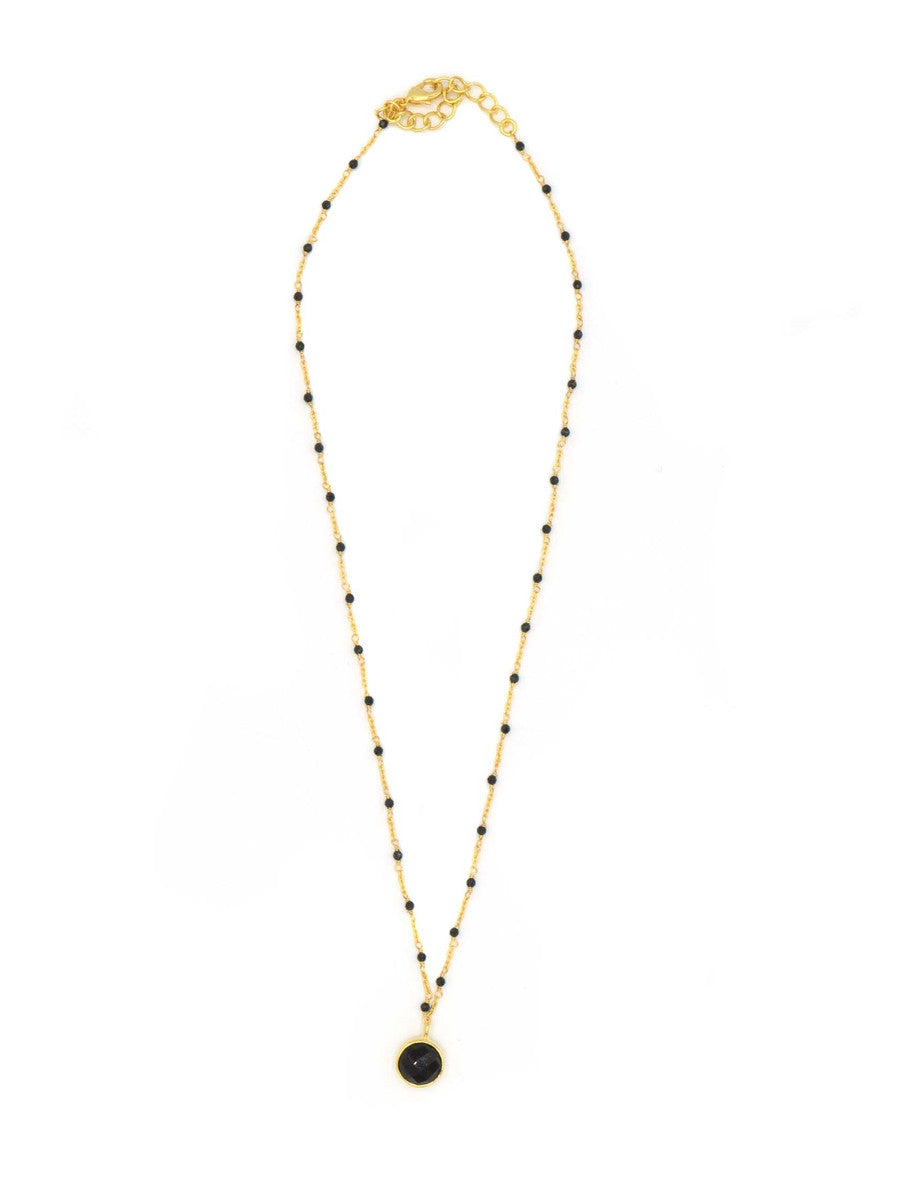 Black beaded gold drop necklace by Fair Anita worn as a layering necklace, fair trade jewelry