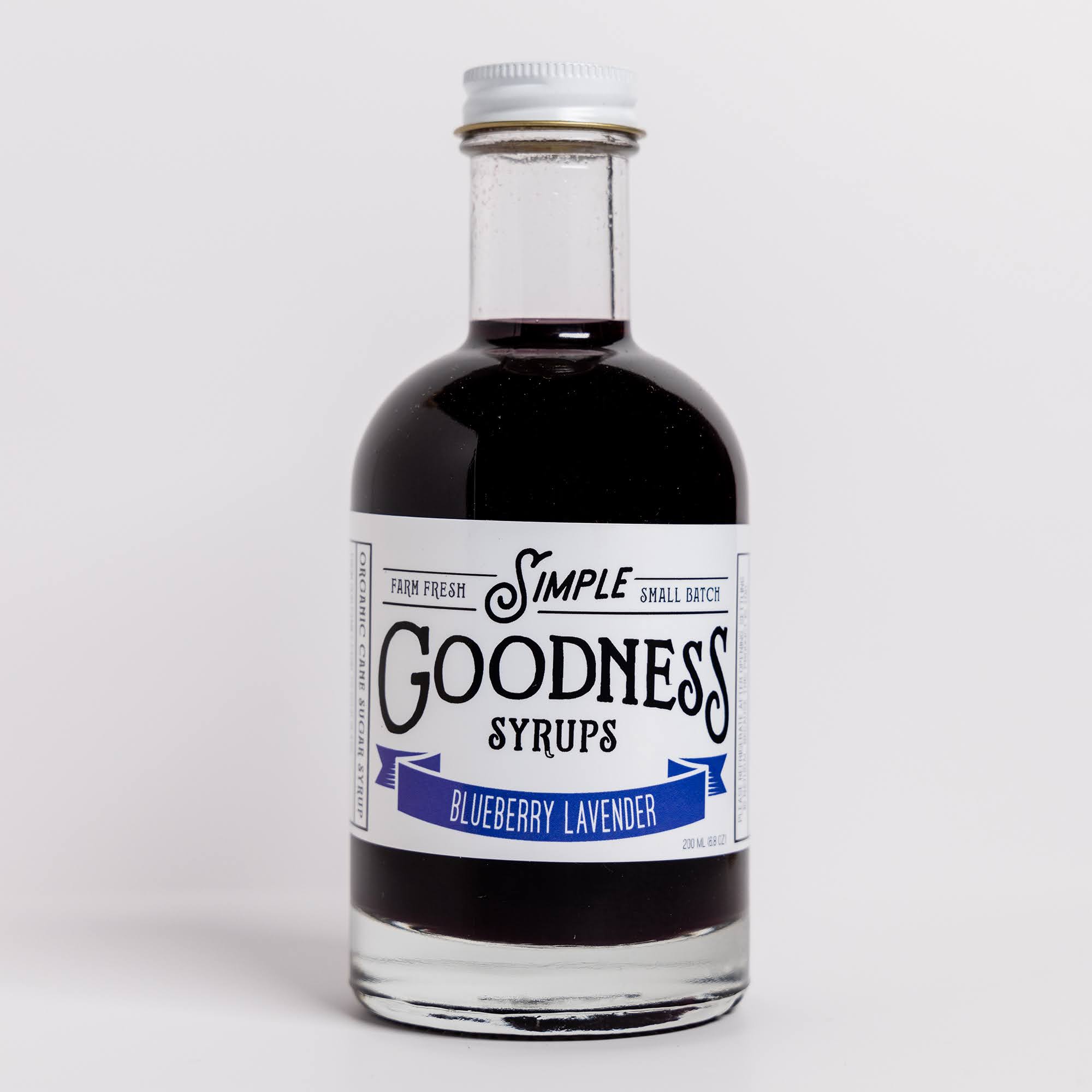 Bottle of Simple Goodness Syrups Blueberry Lavender syrup on a white background