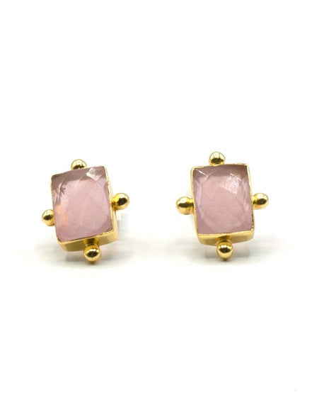 Close-up of Blush and Brass stud earrings showing pink chalcedony stone and gold-toned brass setting by Fair Anita