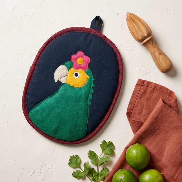Bonito the Parrot Potholder in a kitchen setting as a heat-resistant potholder